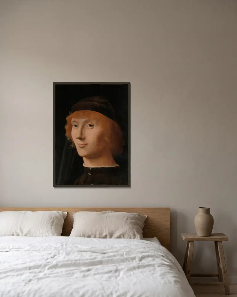 Portrait of a Young Man av Antonello da Messina inramad på en vägg