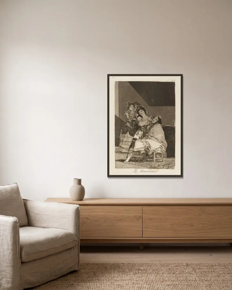 Sie rupft ihn von Francisco de Goya gerahmt an einer Wand