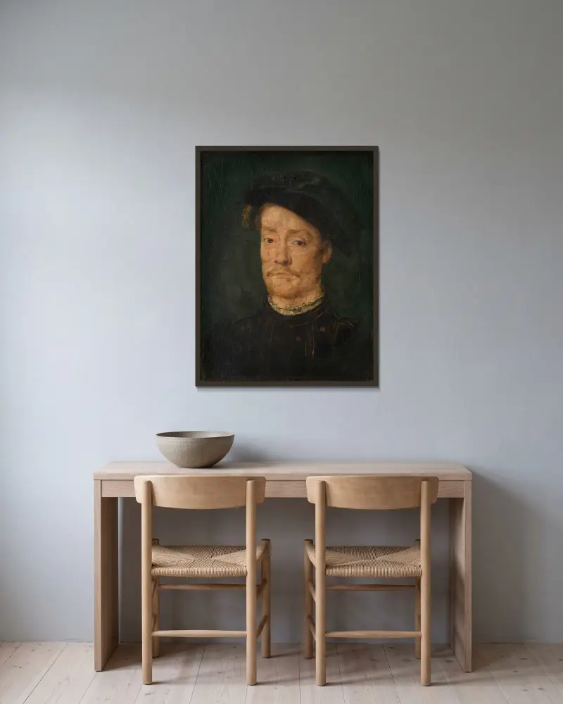 Portrait of a Man – nr 1 av Corneille de Lyon inramad på en vägg