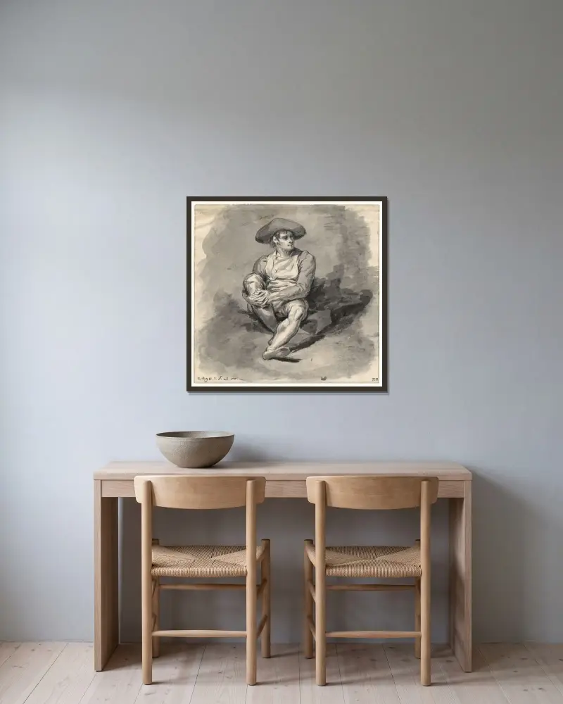 Sittande mansfigur med armarna runt ett knä av David Humbert de Superville inramad på en vägg
