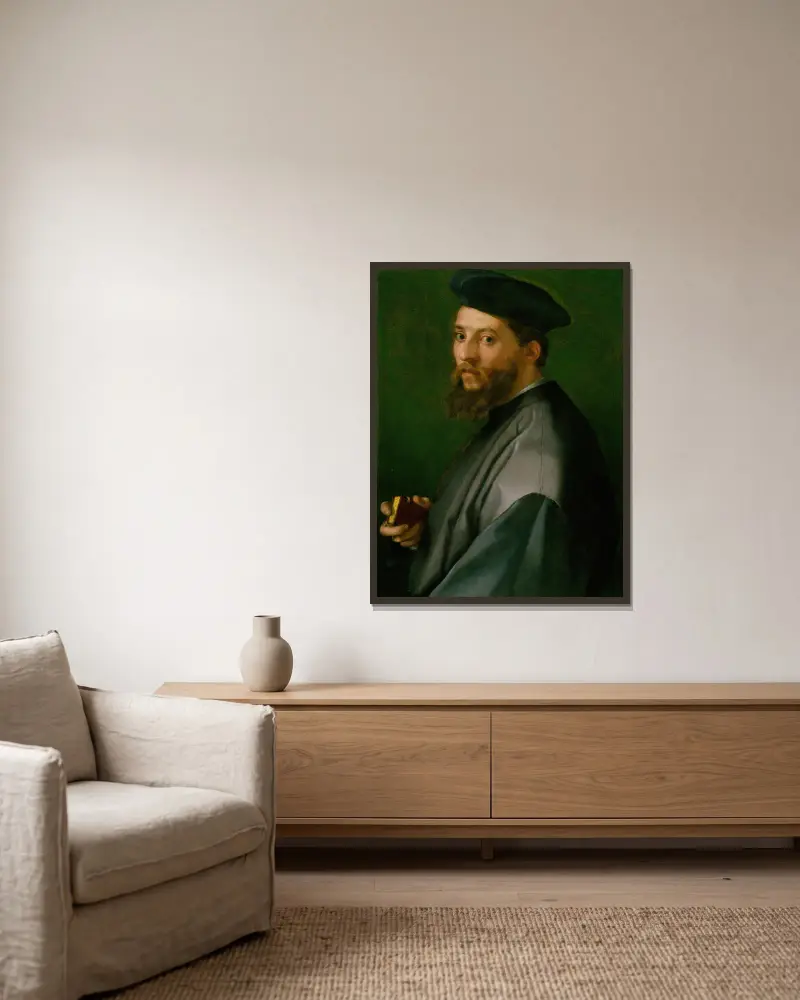 Portrait of a Man av Andrea del Sarto inramad på en vägg