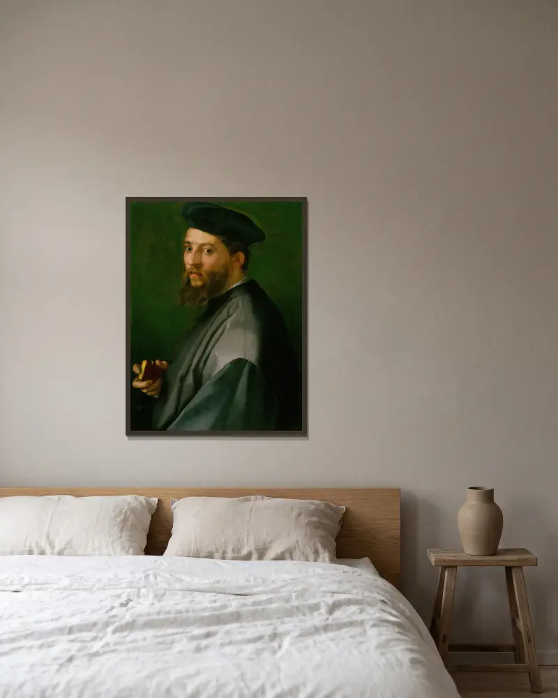 Portrait of a Man av Andrea del Sarto inramad på en vägg