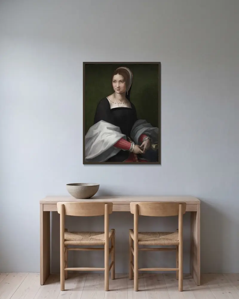 Portrait of a Woman av Andrea del Sarto inramad på en vägg