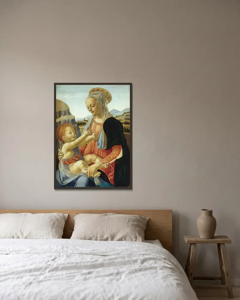 Jungfrun med det sittande barnet av Andrea del Verrocchio inramad på en vägg