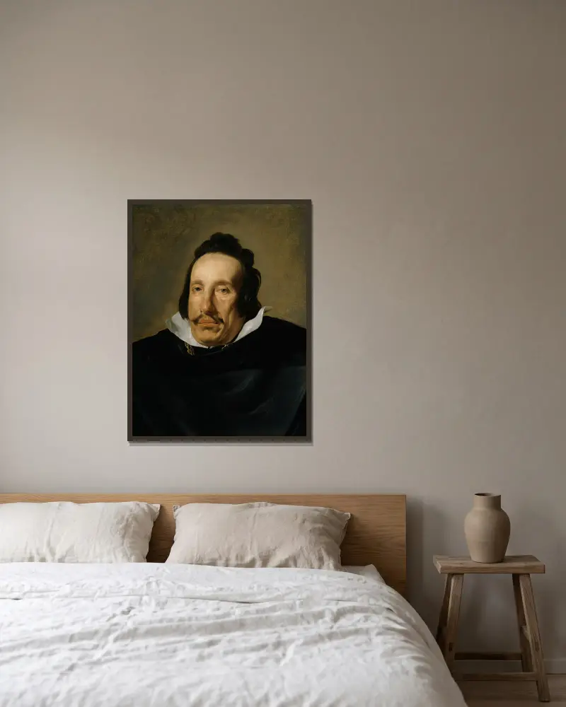 Portrait of a Man av Diego Velázquez inramad på en vägg