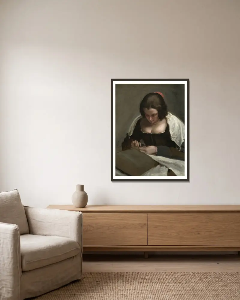The Needlewoman av Diego Velázquez inramad på en vägg