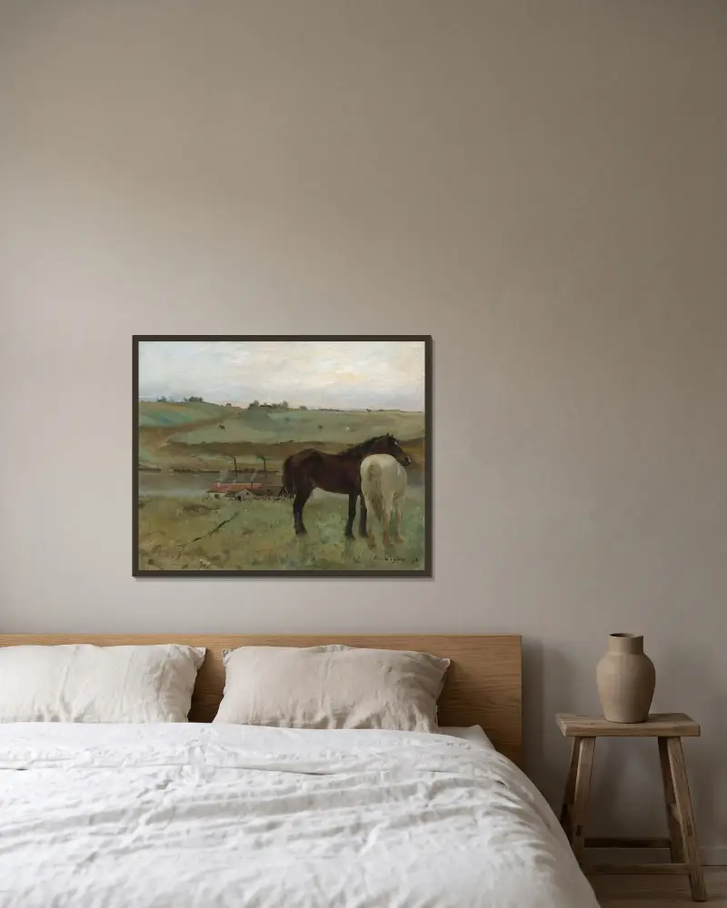 Horses in a Meadow av Edgar Degas inramad på en vägg