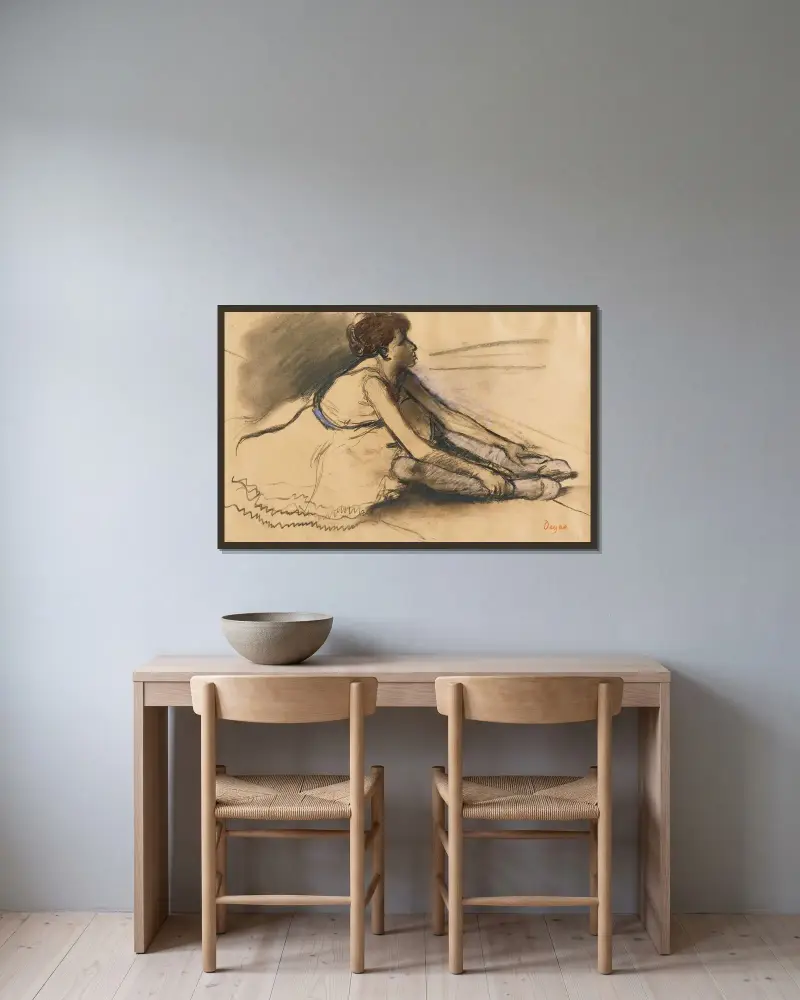 Le Repos De La Danseuse av Edgar Degas inramad på en vägg