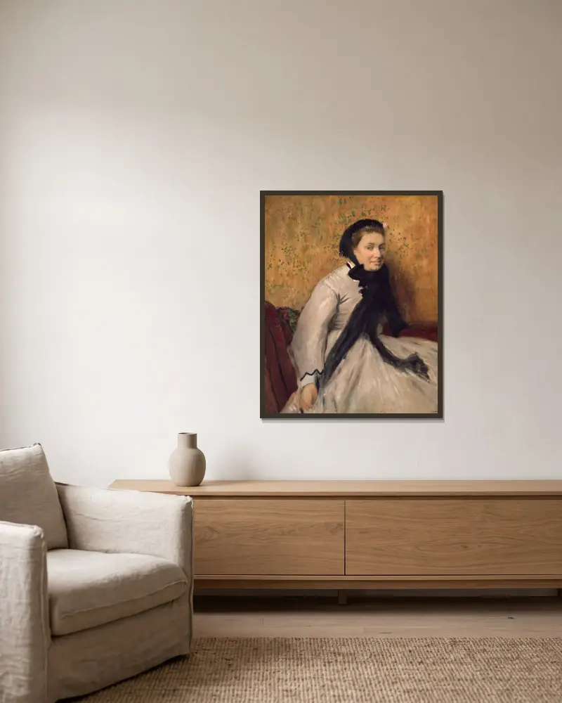 Bildnis einer Frau in Grau von Edgar Degas gerahmt an einer Wand