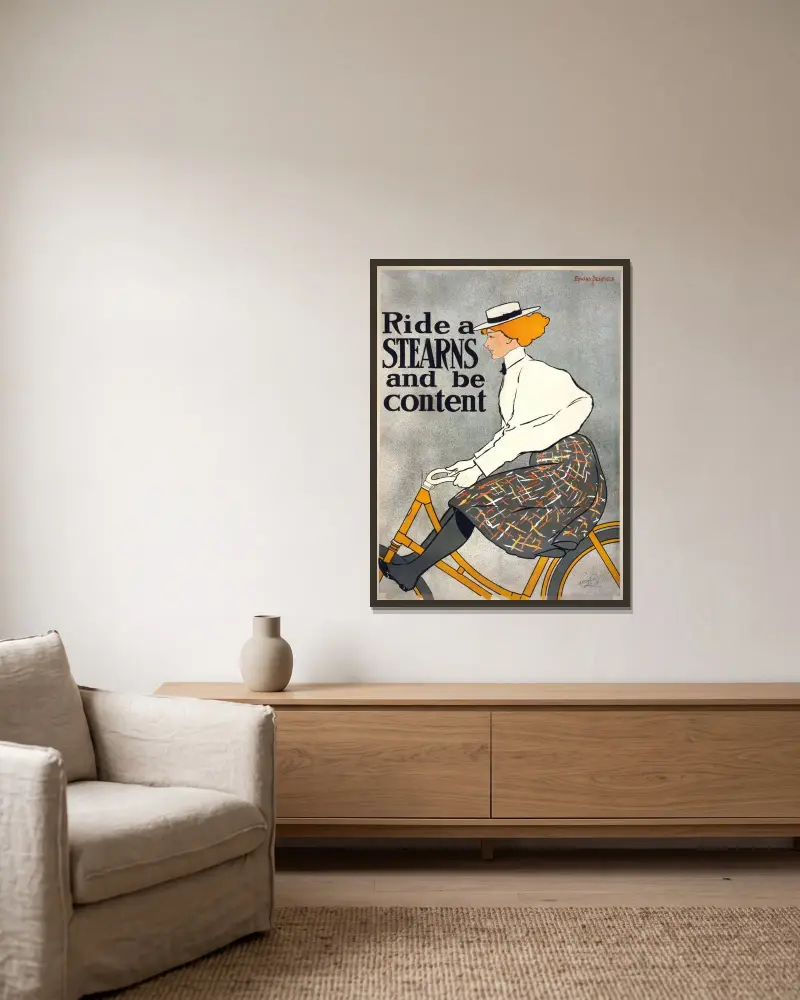 Ride a Stearns & be content av Edward Penfield inramad på en vägg