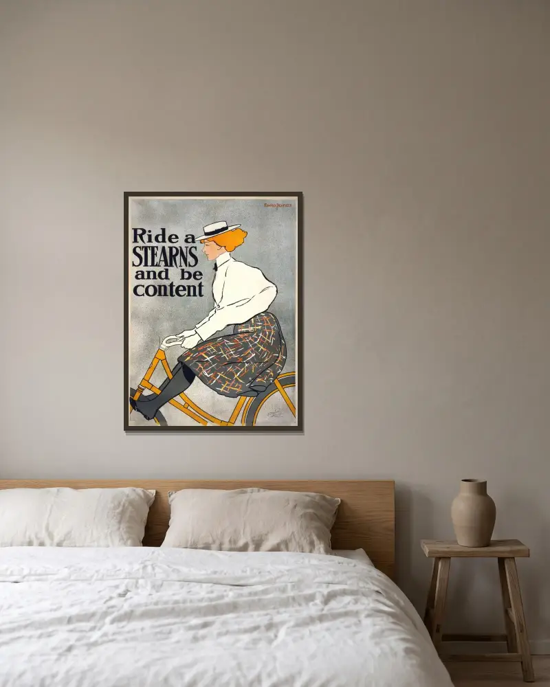 Ride a Stearns & be content av Edward Penfield inramad på en vägg