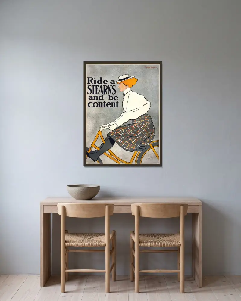 Ride a Stearns & be content av Edward Penfield inramad på en vägg