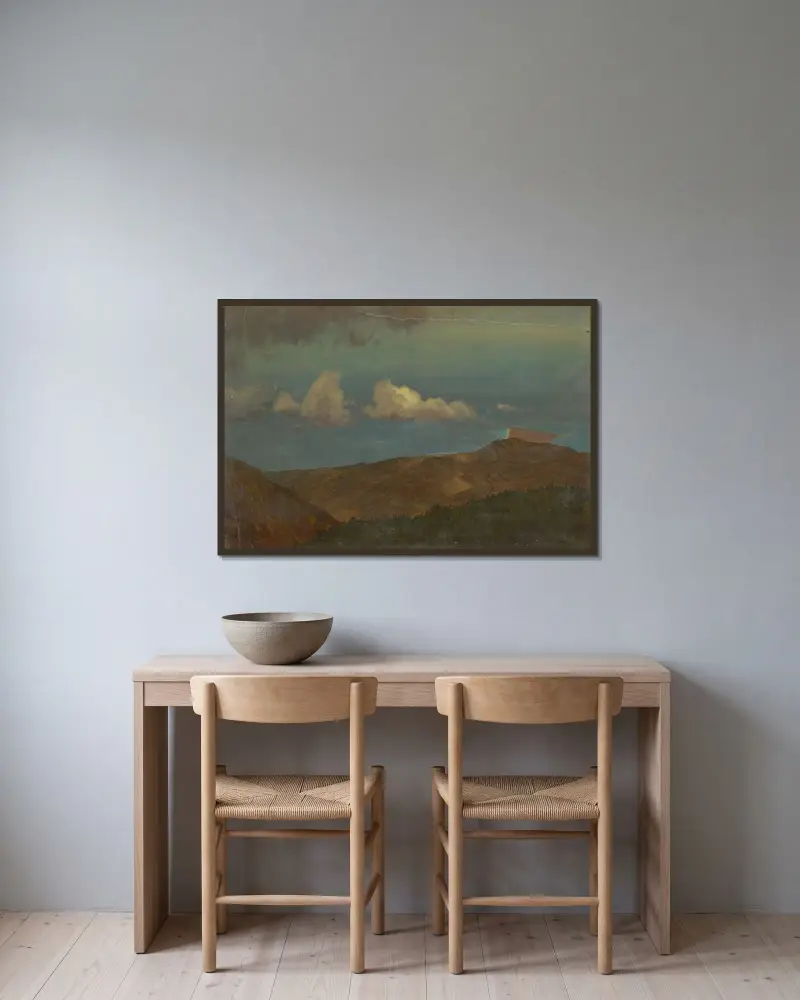 Kuperat landskap av Frederic Edwin Church inramad på en vägg