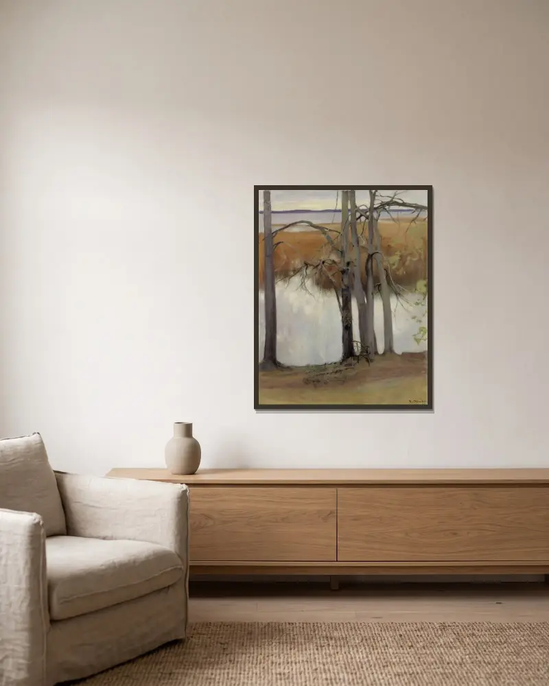Sjöstrand med vass av Eero Järnefelt inramad på en vägg
