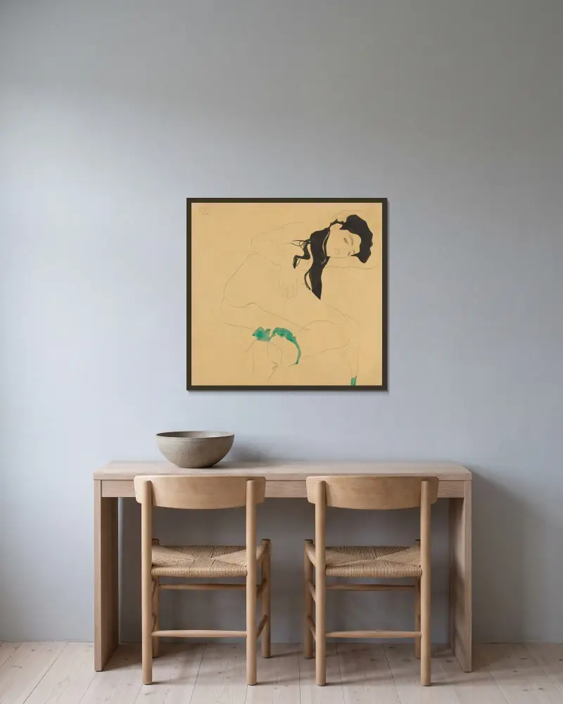 Liegender Mädchenakt von Egon Schiele gerahmt an einer Wand