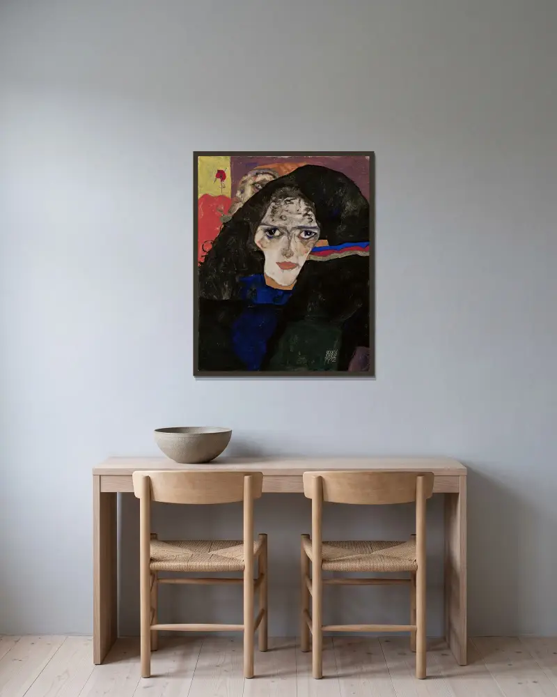 Trauernde Frau von Egon Schiele gerahmt an einer Wand