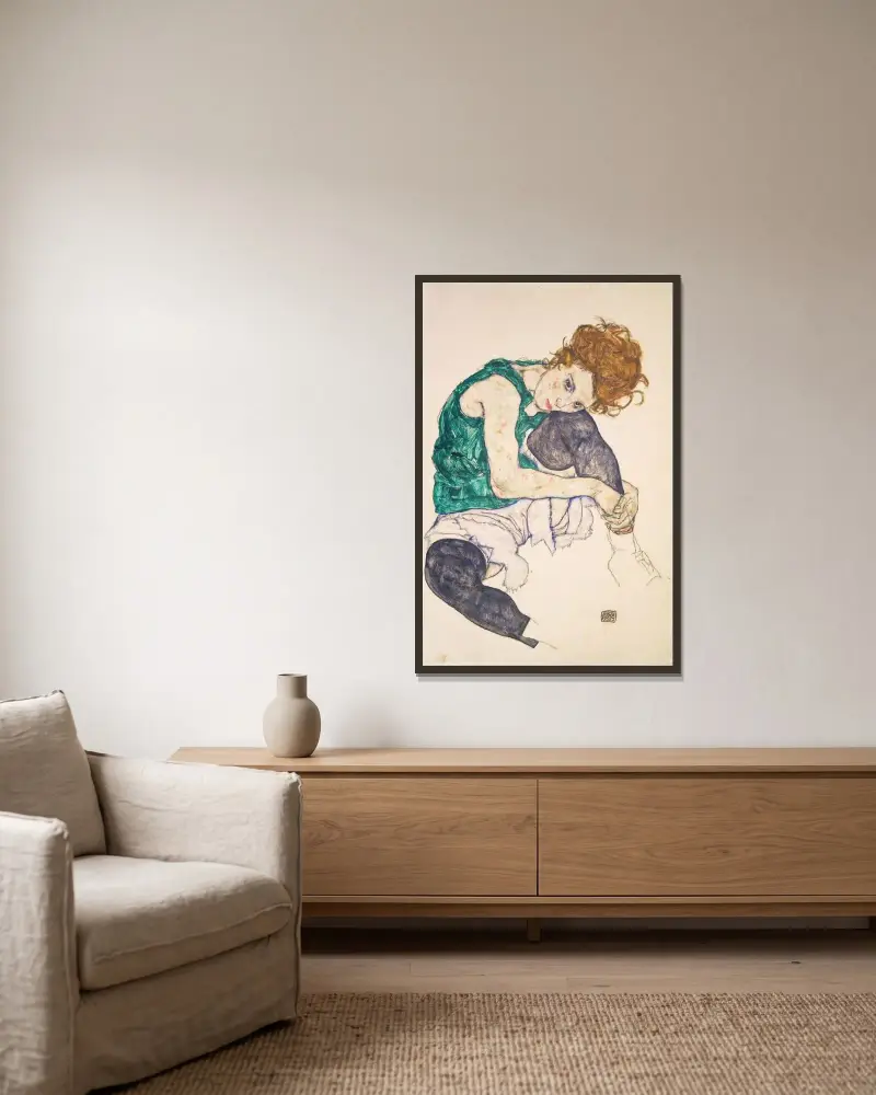 Seated Woman with Bent Knees (Adele Herms) av Egon Schiele inramad på en vägg