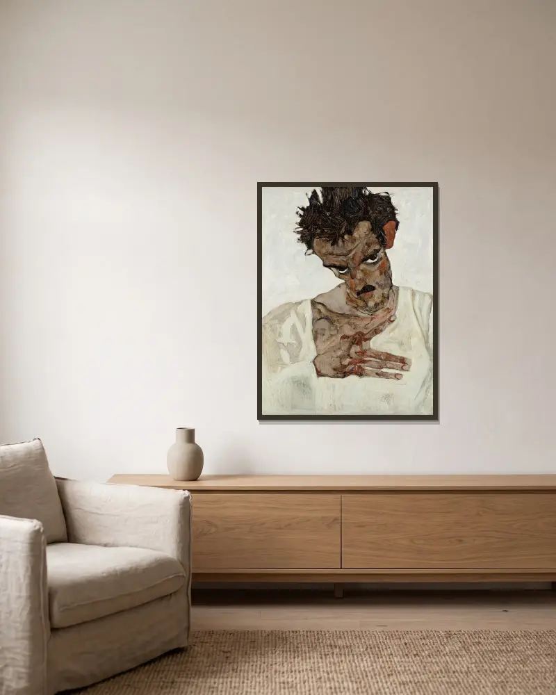Selbstbildnis mit gesenktem Kopf von Egon Schiele gerahmt an einer Wand