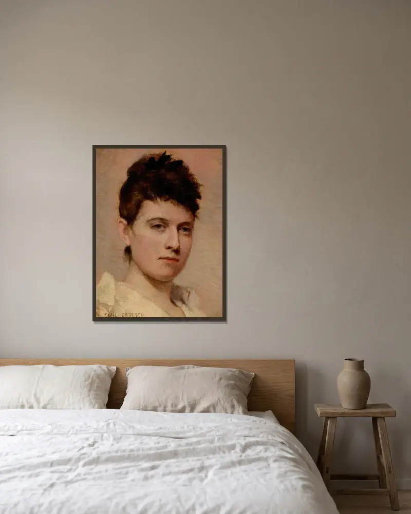 Porträtt av en ung kvinna av Emil Carlsen inramad på en vägg