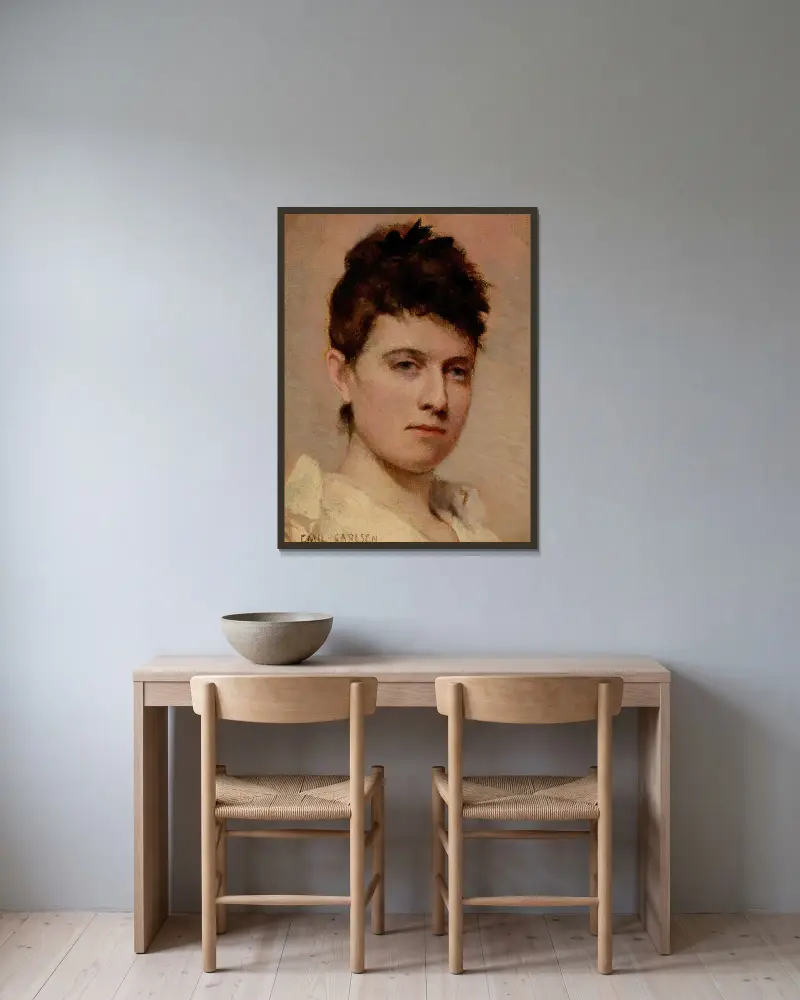 Porträtt av en ung kvinna av Emil Carlsen inramad på en vägg