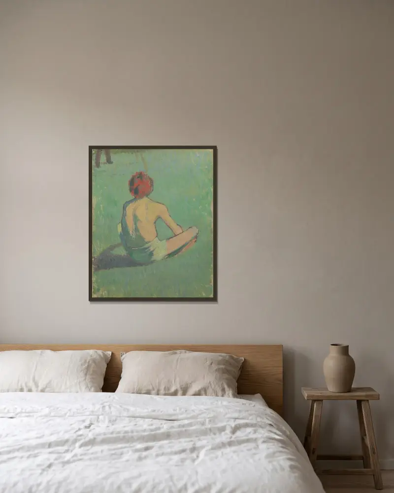 Pojke sittande i gräset av Emile Bernard inramad på en vägg