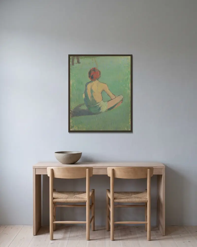 Pojke sittande i gräset av Emile Bernard inramad på en vägg
