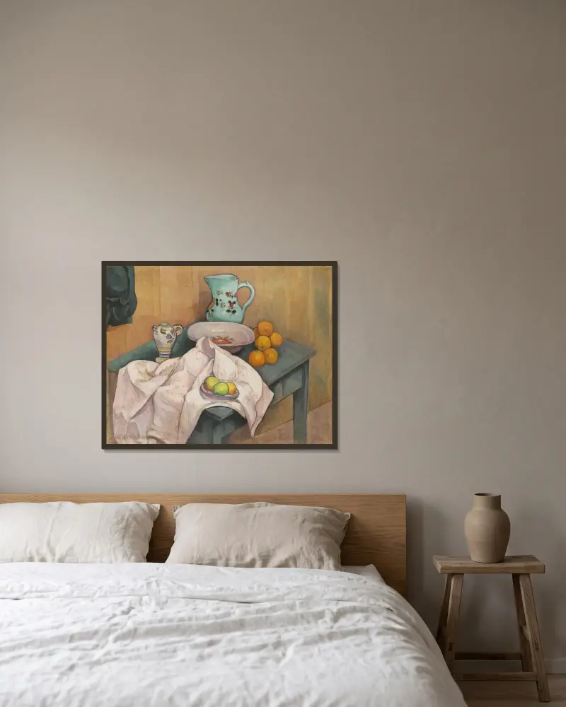 Stilleben med kanna och frukt på utbredd servett av Emile Bernard inramad på en vägg