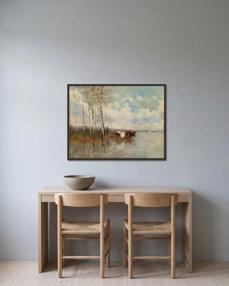Landskap med kor och björkar vid floden av Emile Claus inramad på en vägg