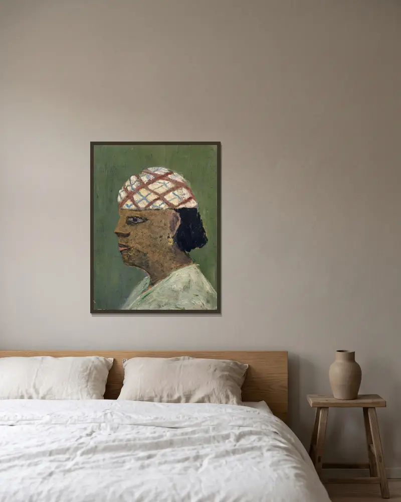 Head of a Woman of the Sudan av Ernst Schiess inramad på en vägg