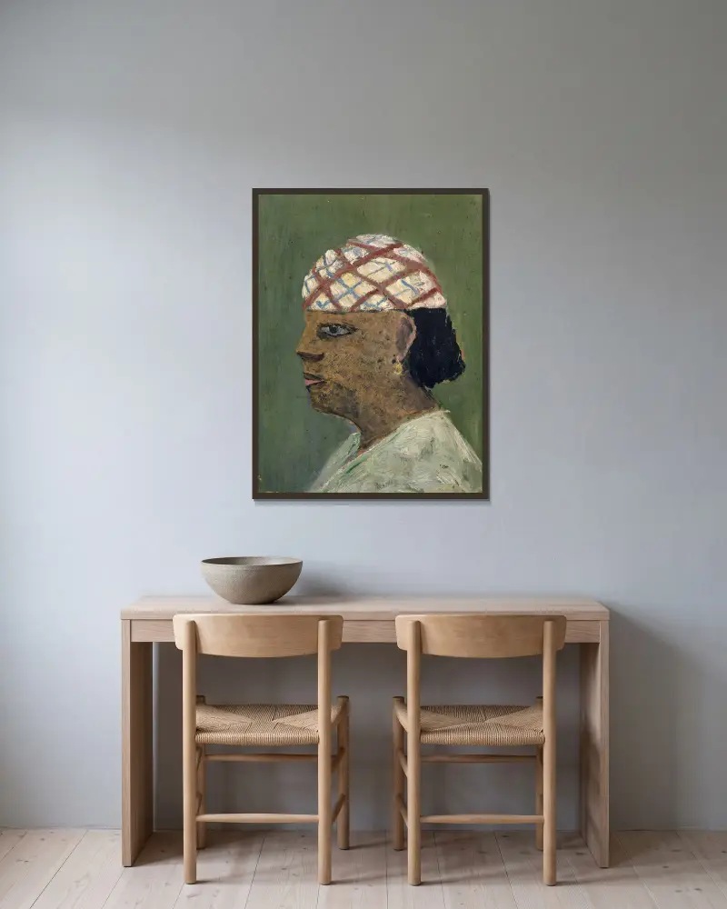 Head of a Woman of the Sudan av Ernst Schiess inramad på en vägg