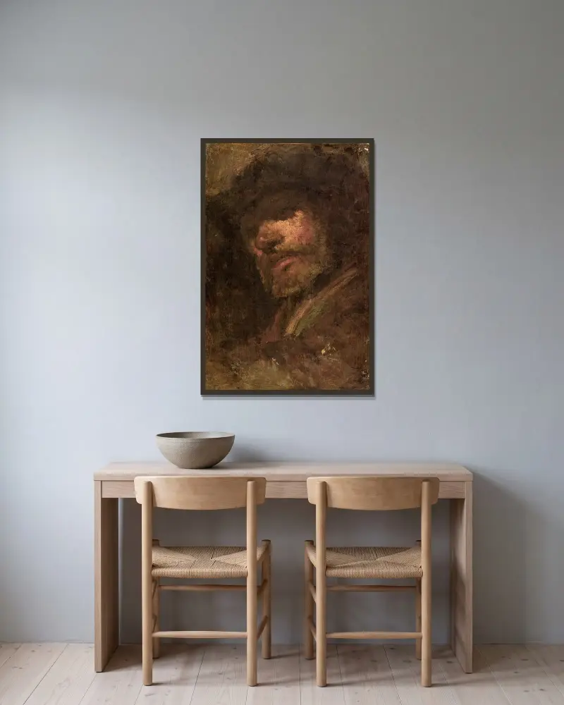 Trumslagaren, manshuvud efter Rembrandt av Félix Ziem inramad på en vägg