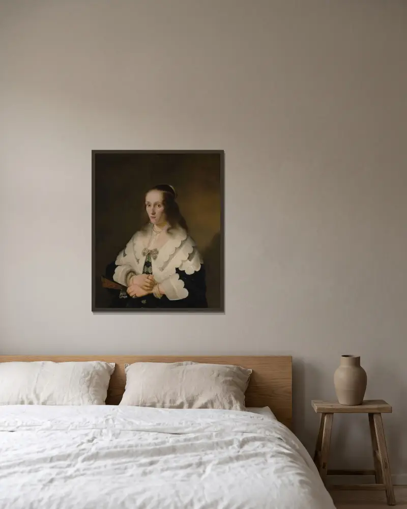 Porträtt av en kvinna av Ferdinand Bol inramad på en vägg