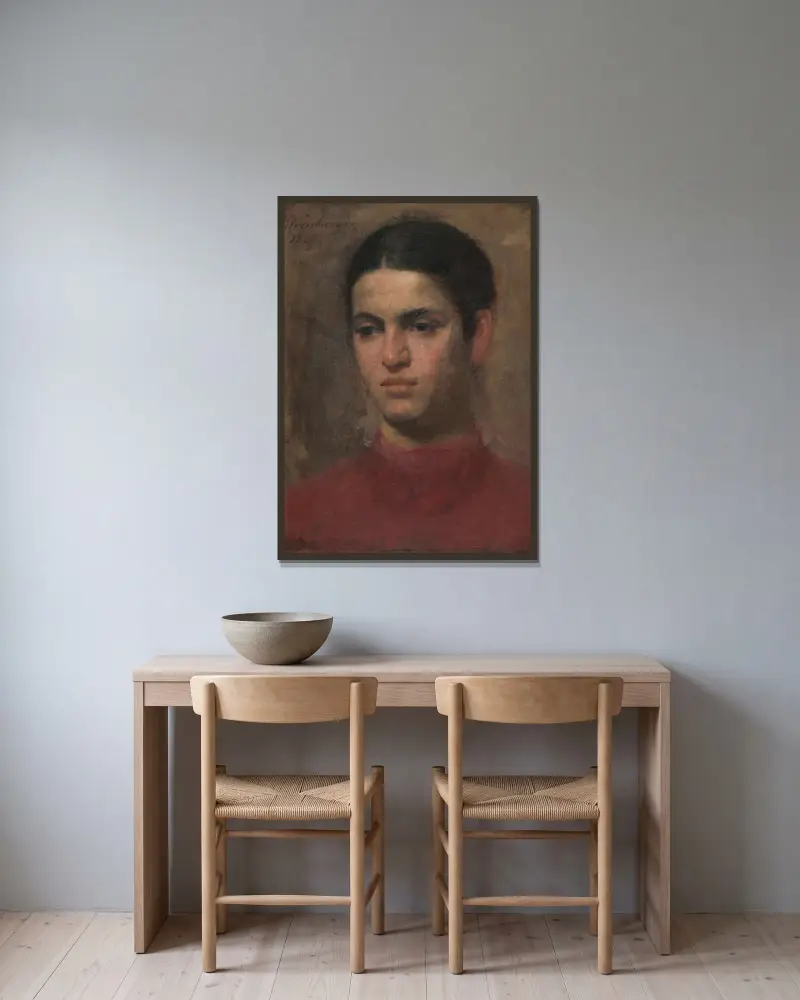 Mädchenkopf von Ferdinand Katona gerahmt an einer Wand