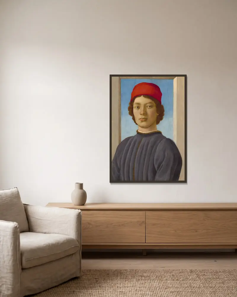 Bildnis eines Jünglings von Filippino Lippi gerahmt an einer Wand