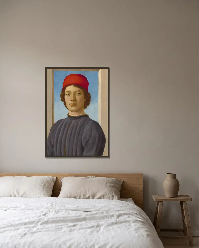 Bildnis eines Jünglings von Filippino Lippi gerahmt an einer Wand