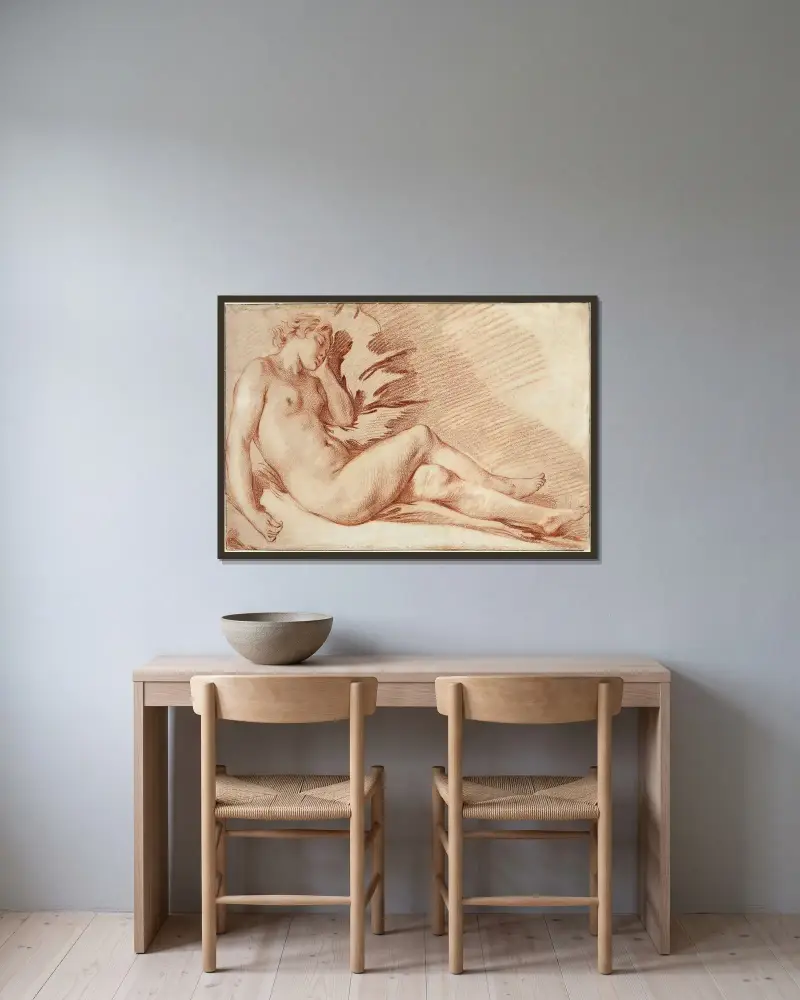 Liggande kvinnlig nakenstudie av François Boucher inramad på en vägg
