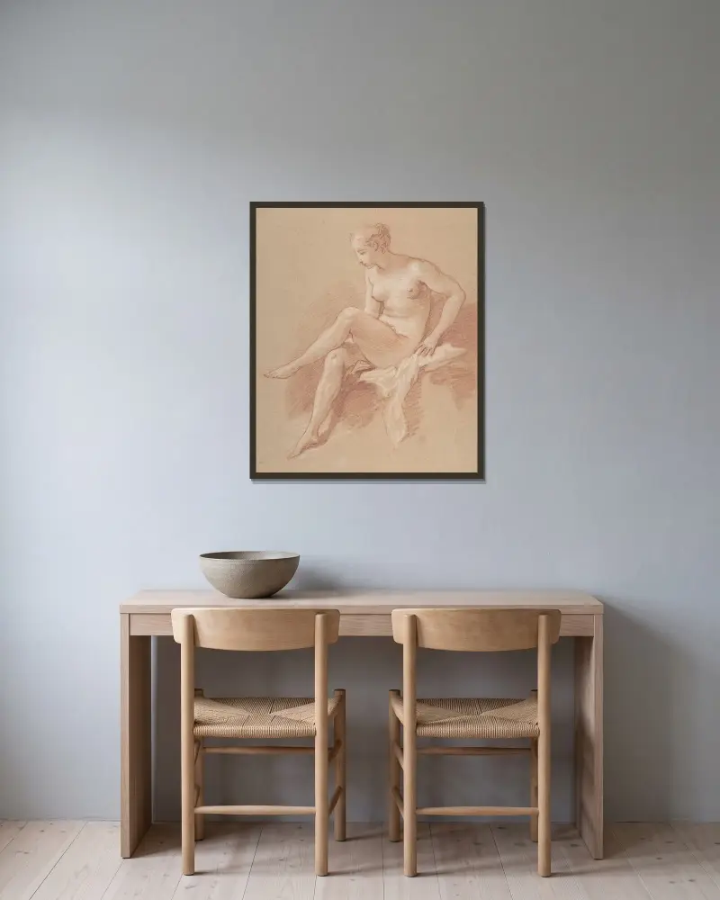 Sittande kvinnlig nakenstudie av François Boucher inramad på en vägg