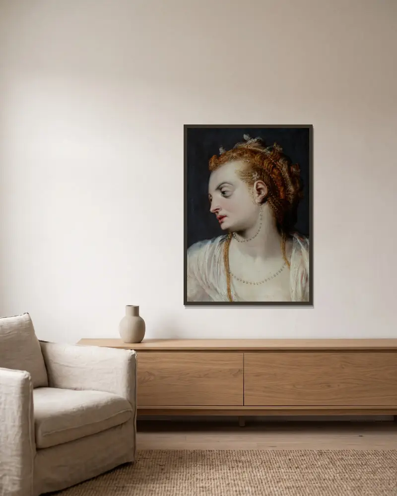 Studie hlavy mladé ženy v bílém av Frans Floris inramad på en vägg