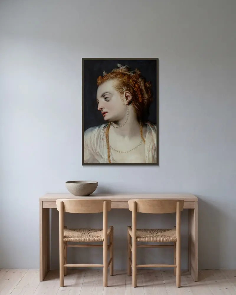 Studie hlavy mladé ženy v bílém av Frans Floris inramad på en vägg