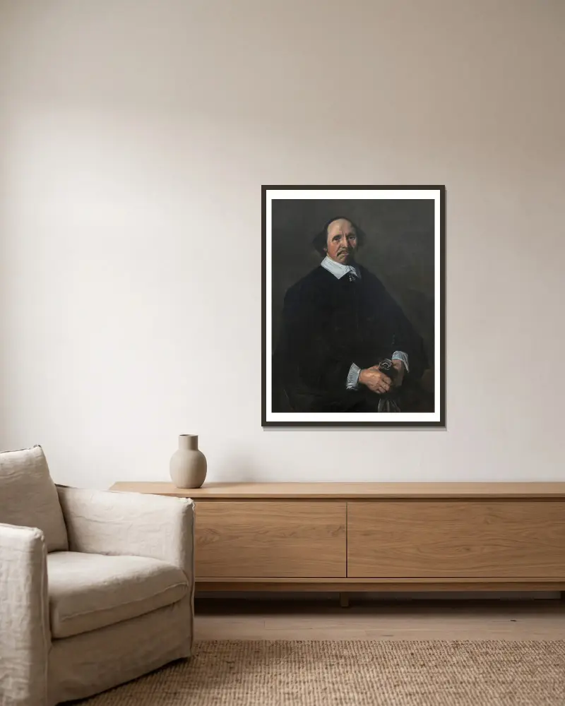Portrait of a Man – nr 2 av Frans Hals inramad på en vägg