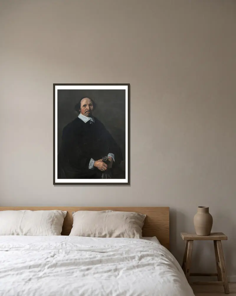 Portrait of a Man – nr 2 av Frans Hals inramad på en vägg
