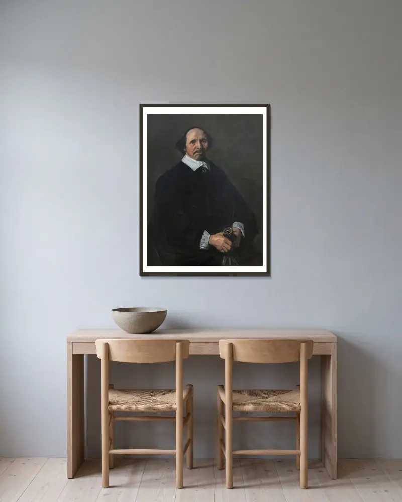 Portrait of a Man – nr 2 av Frans Hals inramad på en vägg