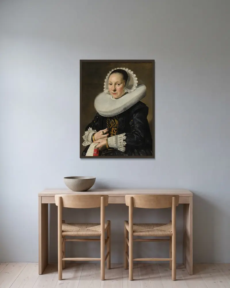 Porträtt av en kvinna, troligen Aeltje Dircksdr. Pater av Frans Hals inramad på en vägg