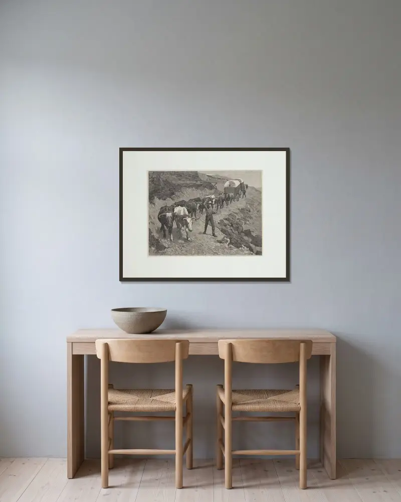 En oxskjuts i bergen av Frederic Remington inramad på en vägg