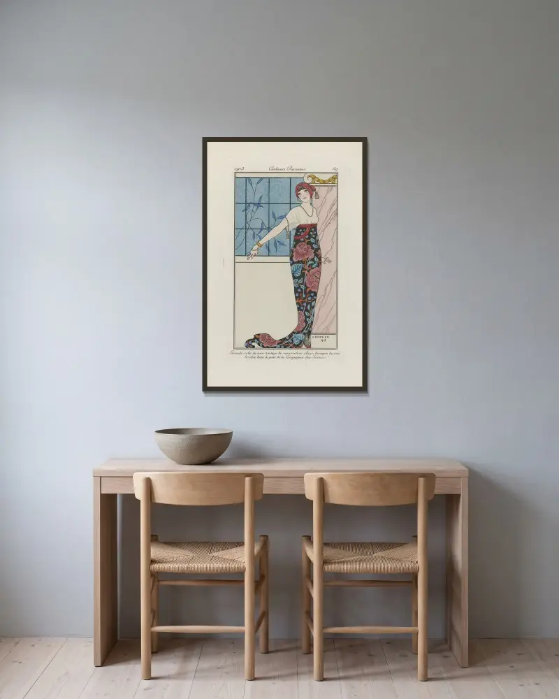 Stor aftonklänning av George Barbier inramad på en vägg