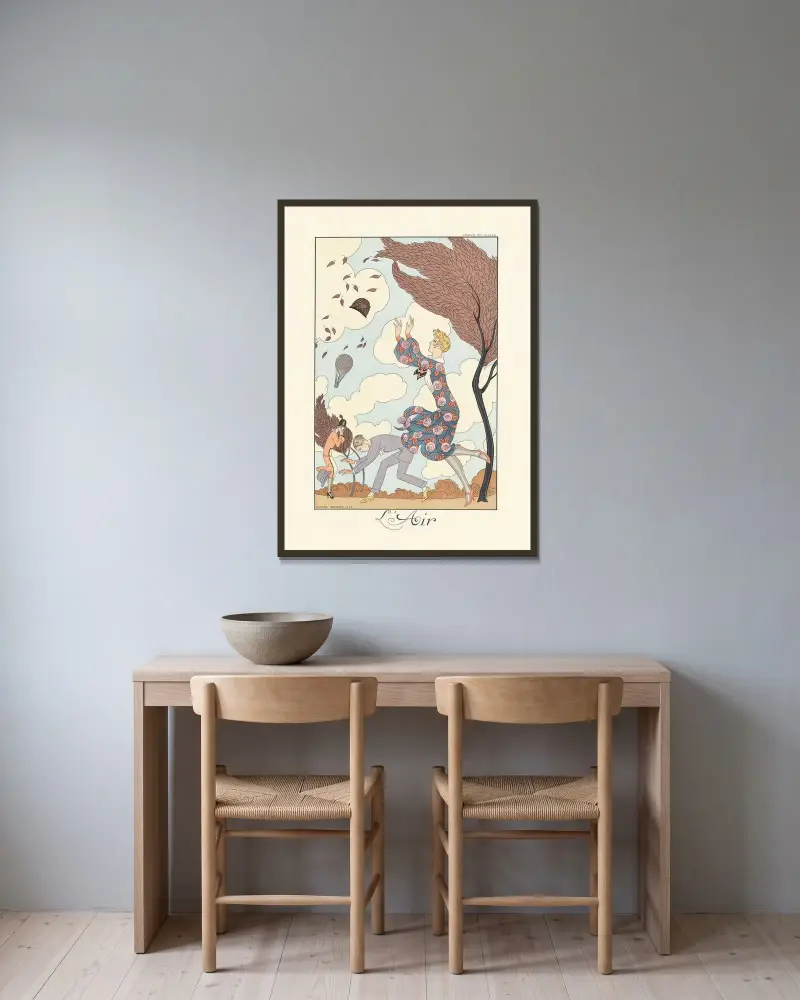 Luft av George Barbier inramad på en vägg