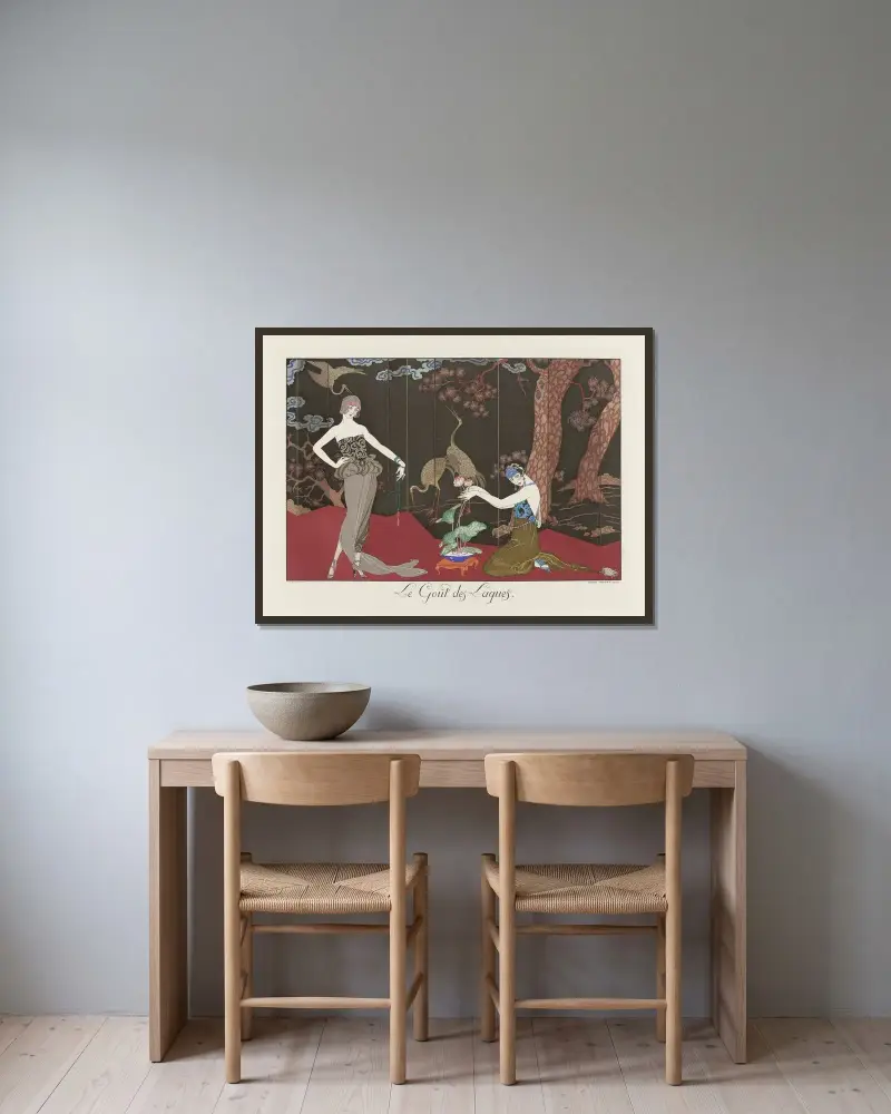 Smaken för lack av George Barbier inramad på en vägg
