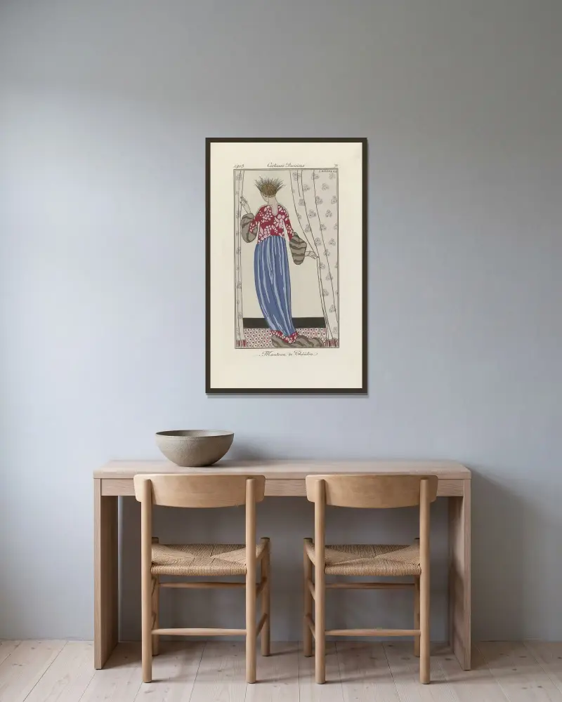 Teaterkappa av George Barbier inramad på en vägg