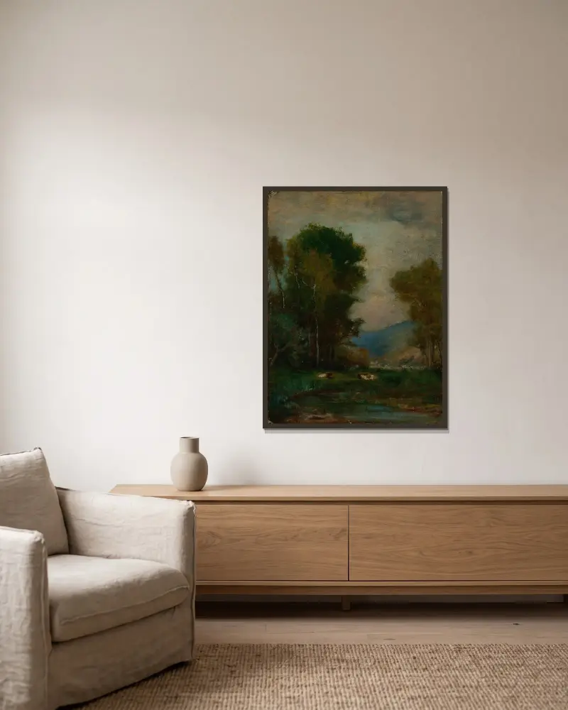 Kor vid en bäck av George Inness inramad på en vägg