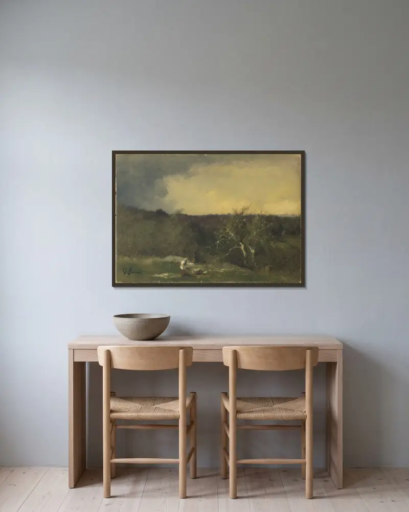 Landskap av George Inness inramad på en vägg